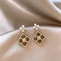 Macro detail of vintage style flower drop earrings with green zircon and white pearls - Rhombus Flower Drop Style (HE29058) / Silver-Green