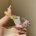 Pulsera artesanal de cuentas de cuarzo fantasma púrpura y citrino, mostrada en la mano - Pulsera 6# (Cristal Geométrico y Con Caja de Regalo) / Amatista Citrina