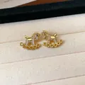 Detailed macro shot of gold-plated rocking horse stud earrings with sparkling pavé crystals - Pave Rocking Horse (32#)