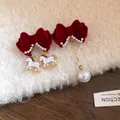 Asymmetrical red velvet bow earrings featuring white horse pendants and a gold chain pearl - Asymmetric Horse (23#)