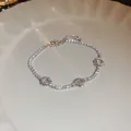 Elegant silver tennis bracelet featuring sparkling cubic zirconia and flower charms - 46# Silver Bracelet