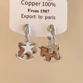 Macro view showing the intricate rocking horse and star charms of these silver-toned earrings - Star Rocking Horse (42#) / 925 Silver Needle / Silver Star