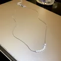 Detail shot of elegant mermaid pearl necklace with seven pearls on silver chain - Geometric Rows Pearl (4#)
