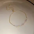 Elegant gold adjustable chain bracelet featuring radiant rectangular zirconia charms - Geometric Square Style (HB5088) / Gold