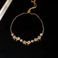 Elegant gold-tone box chain bracelet featuring three sparkling zircon butterfly charms - Bowknot Style (HB5086) / Gold