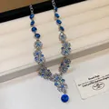 Detail shot of a French vintage floral necklace with blue and clear rhinestones - Necklace Only (Without Earrings) / Silver Blue