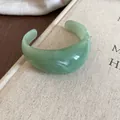 Retro green resin cuff bracelet with marbled texture in SKU display view. - Open Marble Style / Green