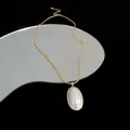 Elegant 14k gold plated chain necklace featuring a large oval pearl pendant on a mirror - Gold (Real Gold Plated)