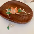 Elegant variant of hair clip featuring an orange flower with pearl and leaf tassels - Pink Flower Tassel Figure-8 Clip / Pink