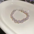 Élégant bracelet de perles vintage français en blanc rosé doux avec éclats de cristal. - Style Réglable Strass Forme de Couronne / Argent