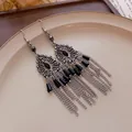 Close-up of vintage silver tassel earrings with black stones and palace retro style - Black Water Drop Hook Style (HE17128)