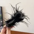 Elegant black ostrich feather hair clip with sparkling bead accents for chic hairstyles - Bow Feather Style