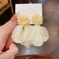 Elegant cream clustered beaded earrings with organza fabric petals on display card - Beige