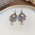 Close-up of ethnic style enamel flower earrings with pearl dangles and pink rhinestones - Ear Hook Style(WE2860) / Gold with Blue White