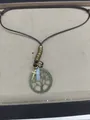 Vintage ethnic style necklace featuring a Tree of Life and cross pendant on a brown cord - Tree Of Life Necklace