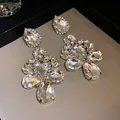 Detailed view of sparkling teardrop crystal earrings with a refined silver-tone finish - Silver