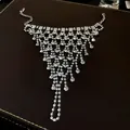 Detailed view of luxury sparkling multi-layer rhinestone tassel hand harness for women - Silver