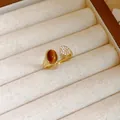 Exquisite 18k gold plated open ring featuring a brown tiger eye stone and pavé zircon - 11# Ring-Gold-Zirconia Disc