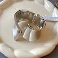 Asymmetrical wide silver-tone metal cuff bracelet in a minimalist style - Glossy Style (6#)