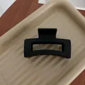 Black flocked matte hair claw clip in a minimalist geometric design for elegant styling - Geometric Matte Black Style 24