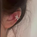 Close-up of elegant star zircon ear cuff worn on the ear bone, Korean fashion style - Left Ear (Single) / Silver