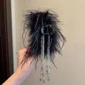 Close-up of elegant black feather hair claw clip with sparkling rhinestone tassels - 52# Black Rhinestone Butterfly Mesh Clip