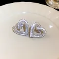 Orecchini a lobo a forma di cuore di lusso con scintillanti zirconi taglio baguette - Argento