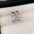 Detail view of elegant rectangular lavender zircon stud earrings in a soft cream jewelry tray - Large / Pink
