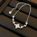 Detailed macro view of silver star pendant necklace with sparkling cubic zirconia stones - Bracelet Only / Silver