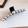 Macro view of elegant black hair claw clip decorated with a row of graduated white pearls - #2 Gripper - Black - Square