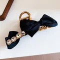 Detailed macro shot of the black ribbon bow and rhinestone embellishments on hair clip. - 19# Claw Clip - Black With Rhinestone Bow