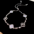 Close-up of elegant hollow flower adjustable bracelet decorated with shimmering zircons - Hollow Out Flower Style (HB3089) / Silver