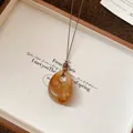 Elegant amber marbled resin pendant necklace with brown cord, SKU variant display. - Style 21-Coffee