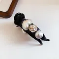 Close-up of black hair claw clip with camellia flower, heart and pearl detail - Heart Pearl Camellia Claw / Black