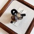 Macro view of French style black hair claw clip with brown agate-like bead and crystal - 12# Claw Clip - Black Mini Diamond-studded