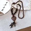 Bohemian long necklace featuring wooden beads, cowrie shells, and a large heart pendant - Necklace #29 - Brown - Heart