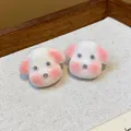 Close-up of cute white puppy resin stud earrings with pink accents - White-Pink