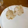 Sweet Mori style fabric flower earrings with elegant gold hollow frame detailing - Earring Hook Style (64#) / White
