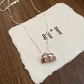 Vintage silver clasp bag pendant necklace on textured paper background - 29# Necklace - Silver