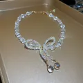 Elegant iridescent crystal bow-knot beaded necklace with drop pendants on golden tray - Bow Crystal Drip Bead Style / 20# Necklace-Transparent