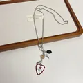 Retro silver-tone chain necklace with heart and star charms on a wooden display board - 14# Necklace-Silver