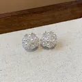 Macro view of elegant flower cluster stud earrings with white pearls and shiny zircons - Flower Cluster Style (HE29037) / Silver