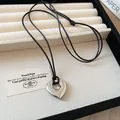 Elegant silver heart pendant necklace with an adjustable black leather cord strap - Hollow Heart Style (2#) / Adjustable / Silver