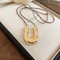Elegant gold U-shaped magnetic eyeglass holder necklace featuring a brown leather cord - Horseshoe Sunglasses Holder Style (11#) / Adjustable / Coffee-Gold