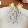 Close-up detail of chiffon flower earrings featuring long elegant pearl bead tassels - Yellow Chiffon Flower (84#)