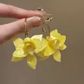 Vibrant yellow flower hoop earrings with pearlescent petals and elegant gold-tone finish - Silver Earring Post Hoop Style (145#) / Yellow