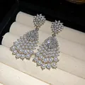 Detail view of vintage court-style drop earrings featuring white pearls and rhinestones - Waterdrop Tassel Style (WE5286) / Silver
