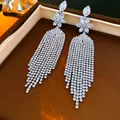 Sparkling silver tassel drop earrings with a flower motif presented in a gift box - Steel Earring Post Six-Petal Floral Tassel Style