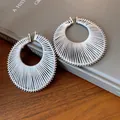 Large silver circular pleated hoop earrings featuring elegant textured thread wrap design - Large / Silver