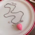 Detailed view of the cute pink resin strawberry pendant and silver ball chain - Stainless Steel Bead Chain Necklace